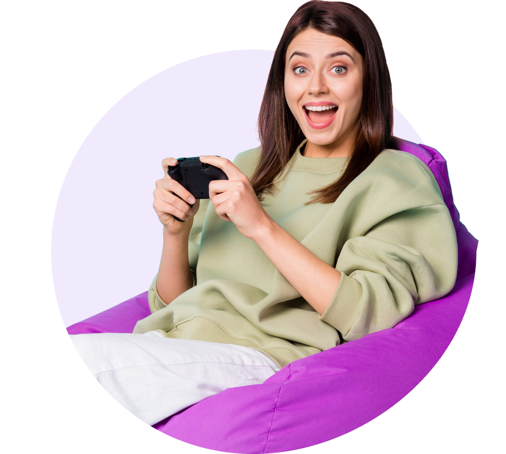 Happy woman on a purple beanbag enjoying